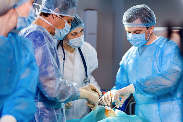 Busy doctors at operating theatre - 写真・画像