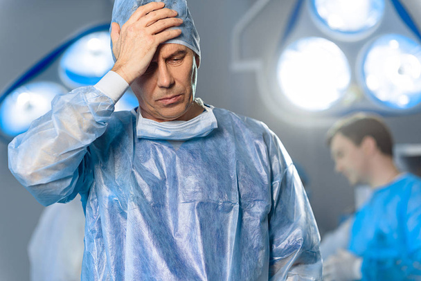 Disappointed doctor at operating theatre - Foto, afbeelding
