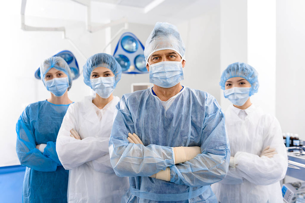 Serious doctors in operating theatre - Foto, imagen