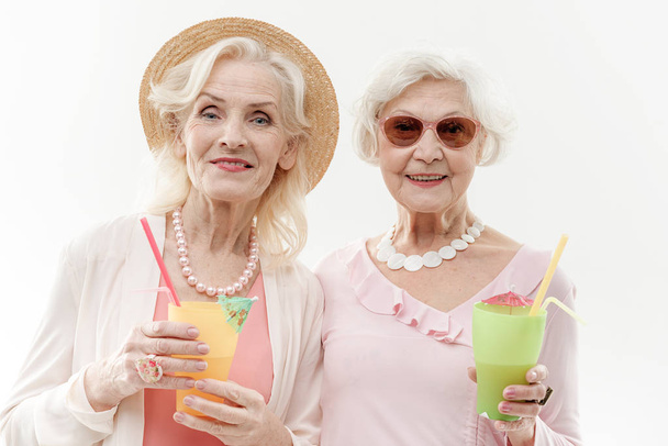 Happy old women having fun with exotic drink - Zdjęcie, obraz