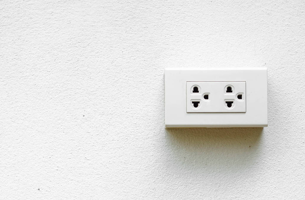 Electricity socket on concrete wall - Foto, Imagen