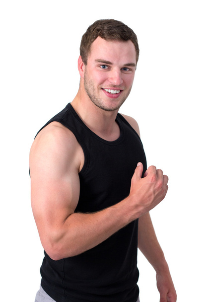 Jeune homme attrayant fléchissant ses biceps
 - Photo, image