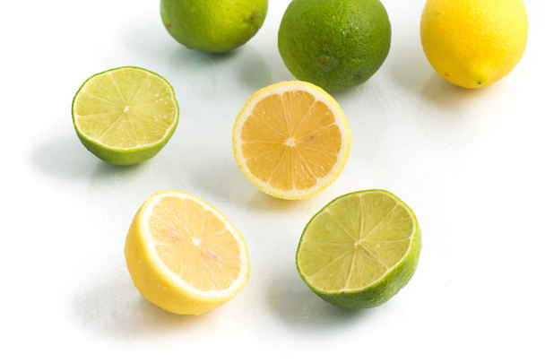 Green and Yellow Lemon or Lime. - 写真・画像