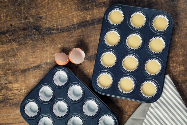 Cupcake butter in metal tray, ready to be bake  - Photo, Image