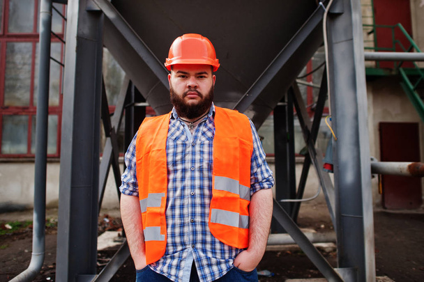 Brutal beard worker man suit construction worker in safety orang - Photo, image