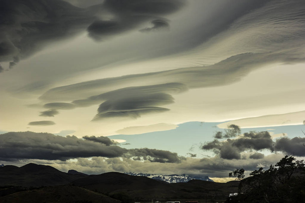 lenticular clouds above snowy mountains in Patagonia - Foto, Imagen
