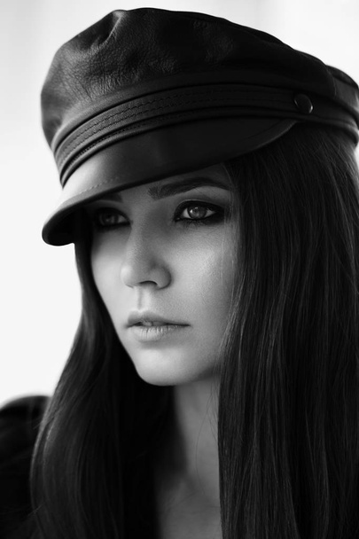 Leather cap on a beautiful girl. - Fotografie, Obrázek