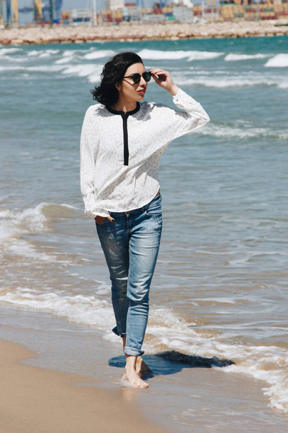 Beautiful young woman walking on The Beach - Фото, зображення