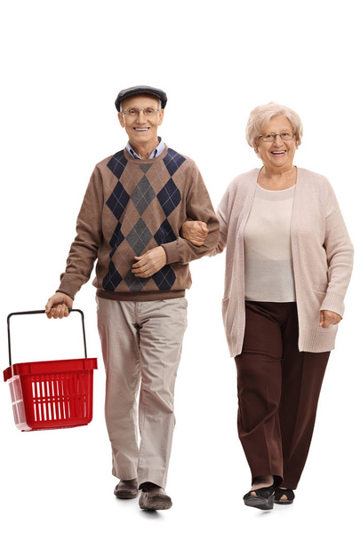 senior couple with an empty shopping basket  - Фото, зображення