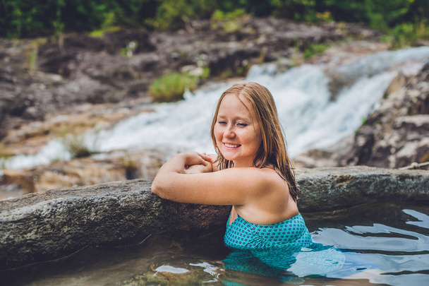 Woman relaxing in hot spring pool  - Photo, Image