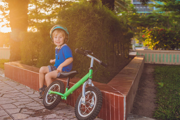  blond kid boy driving bicycle  - Zdjęcie, obraz