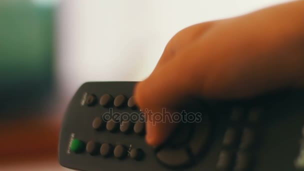 Hand presses Power Off remote control and switches off TV - Footage, Video