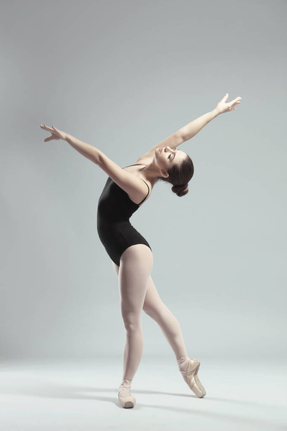Young beautiful ballerina dancing - Foto, Imagen