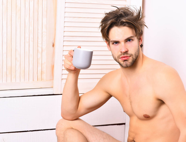 Caucasian bearded sexy macho holding coffee cup - Foto, Imagen