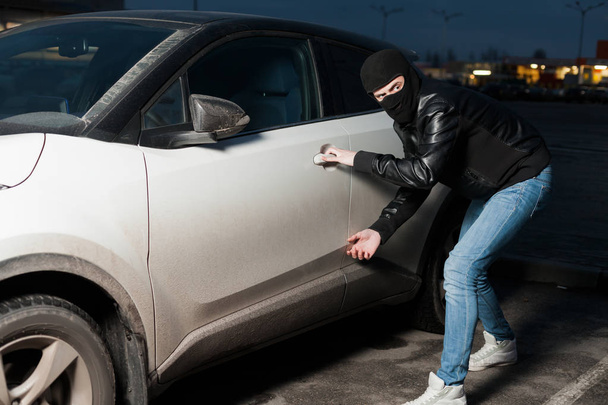  Carjacker unlocking vehicle - Photo, Image