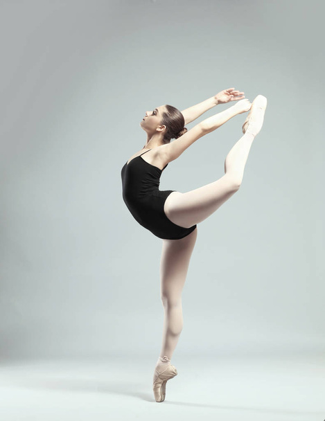 Young beautiful ballerina dancing - Fotó, kép