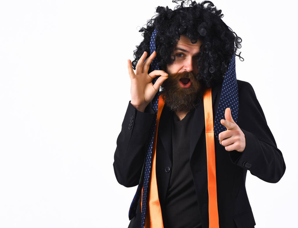 caucasian hipster in suit and black curly wig - Photo, image