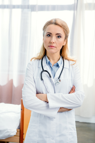 serious doctor with stethoscope - Photo, image