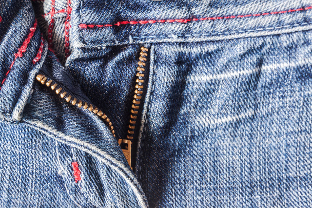 Denim pants to unfasten the zipper close-up - Photo, Image