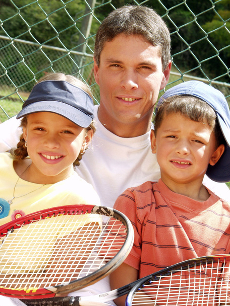 Family tennis portrait. - Foto, afbeelding