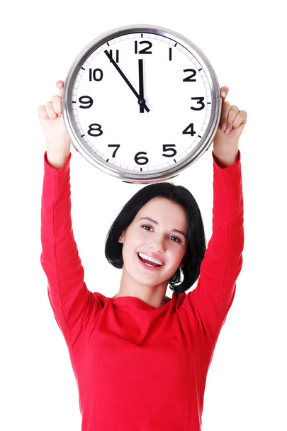 Happy young woman holding office clock - Fotoğraf, Görsel