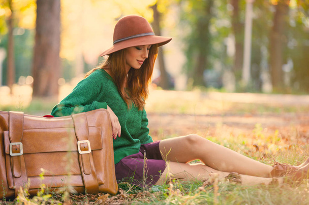 photo of beautiful young woman with suitcase on the wonderful au - Foto, afbeelding