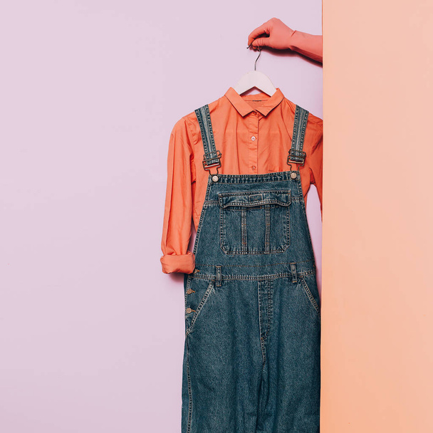 Stylish clothes. Hipster fashion. Pink shirt and denim overalls  - Foto, Imagen
