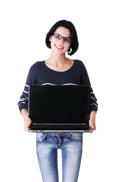 Woman holding 17 inch laptop - Fotoğraf, Görsel