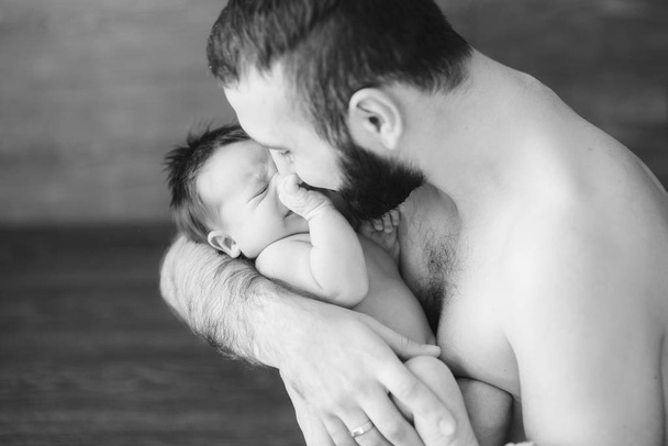 Happy father holding a baby boy - Photo, Image