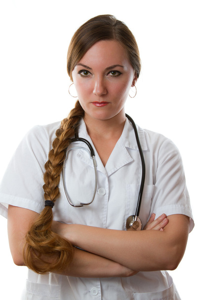 female medical doctor or nurse in white uniform smiling with stethoscope, isolated white background - Photo, image