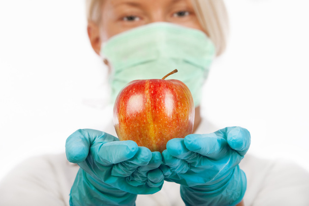 Apple in hands of doctor - Foto, Bild