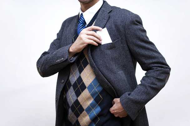 Businessman taking a card out of his pocket - Photo, Image