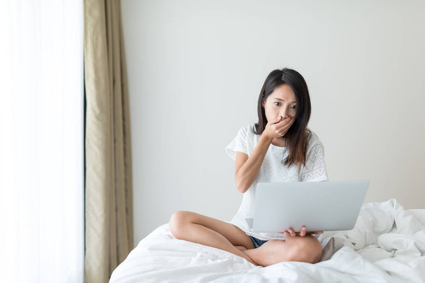 Woman feeling scary on laptop computer - Photo, Image