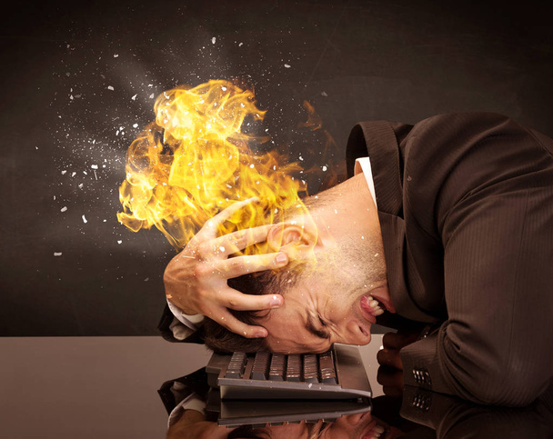 Stressed business man's head is burning - Photo, image