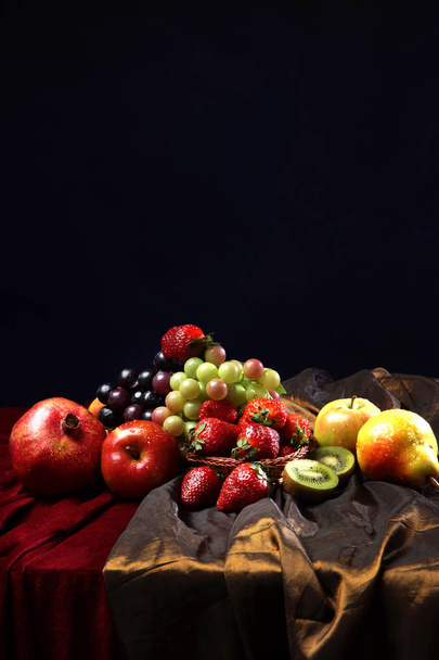Juicy bright fruit, sprinkled with water, still life of seasonal fruits and berries, copyspace - Fotó, kép