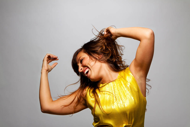 Happy young woman laughing and dancing. - Foto, Imagem