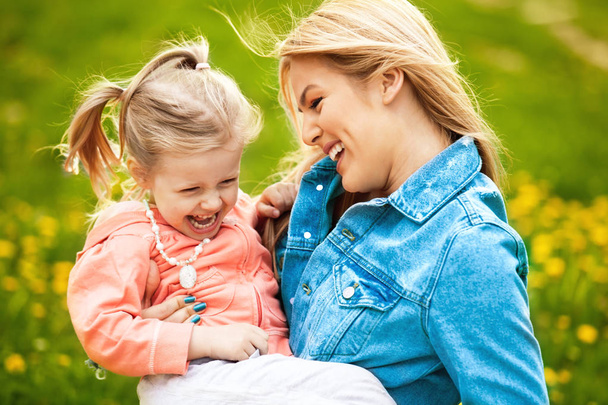 Mother and Daughter Enjoying Spring Day in the Park - Photo, Image