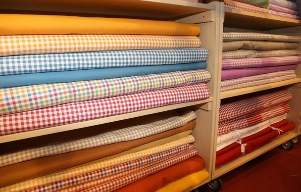 Inside the fabric store with many textile products for sale - Photo, Image