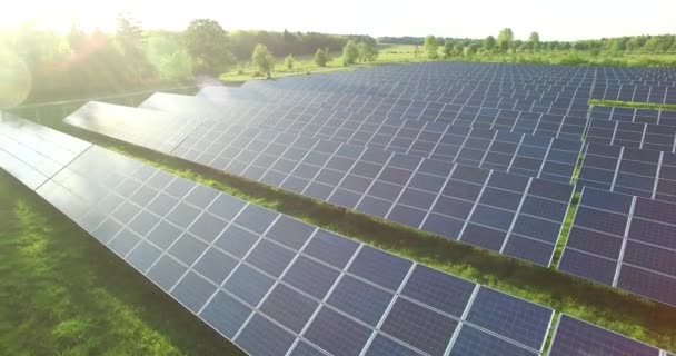Aerial Solar panels in a field on a sunny day,close-up - Filmati, video