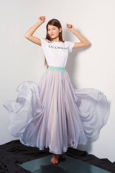 Fashion model in transparent skirt and shirt. Flying dress. - Photo, image