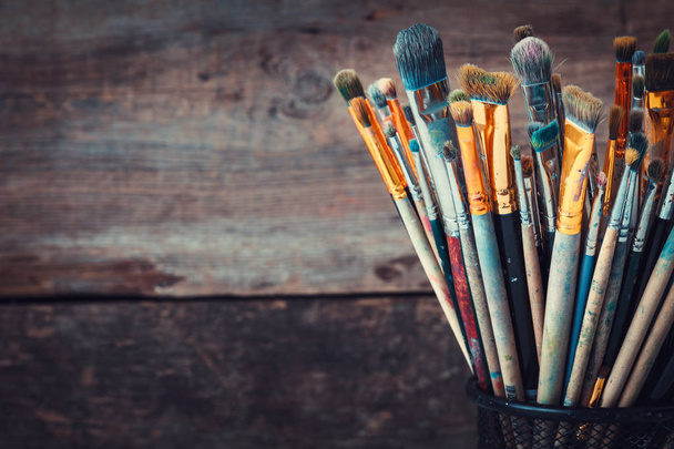 Bunch of paint brushes in a artist studio. Copy space for text.  - Foto, immagini
