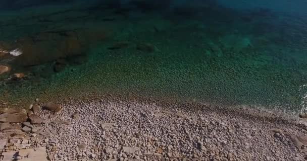  Aerial shot, beautiful transparent paradisiac sea and white stones on the shore in Elba island in Italy, 4K - Footage, Video