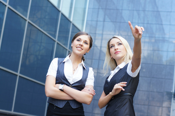 Business women over modern background - Foto, imagen