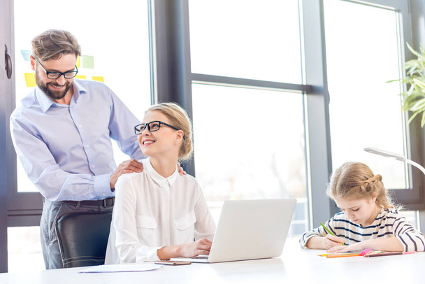 businesswoman and businessman with daughter in office    - Photo, Image