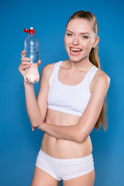 sportswoman with sport bottle - Foto, imagen