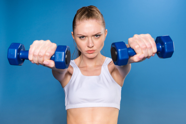 sportswoman training with dumbbells - Photo, Image