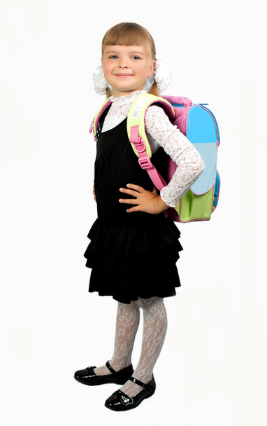 Étudiante en uniforme scolaire avec un sac à dos sur un backgr blanc
 - Photo, image