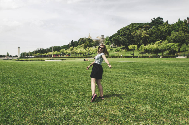 young happy woman running and having fun on grass - Photo, Image