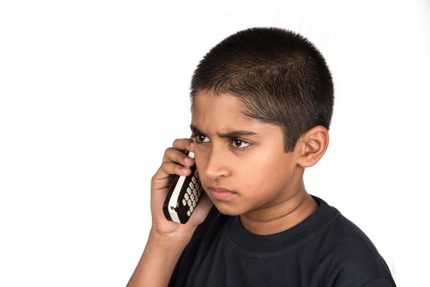 Handsome Indian kid looking very mad talking on phone - Foto, Bild