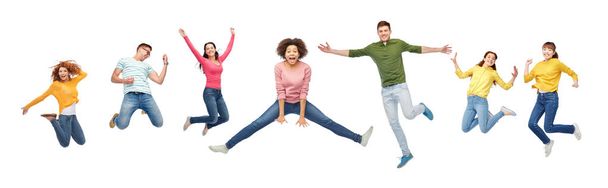 happy people or friends jumping in air over white - Foto, imagen